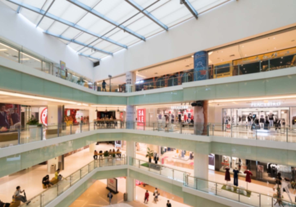 Abstract blur and defocused shopping mall in department store interior for background